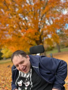 A Forward House of London member smiling in a park.