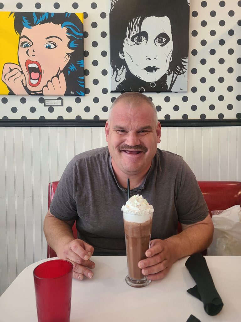 A Forward House of London member eating ice-cream.