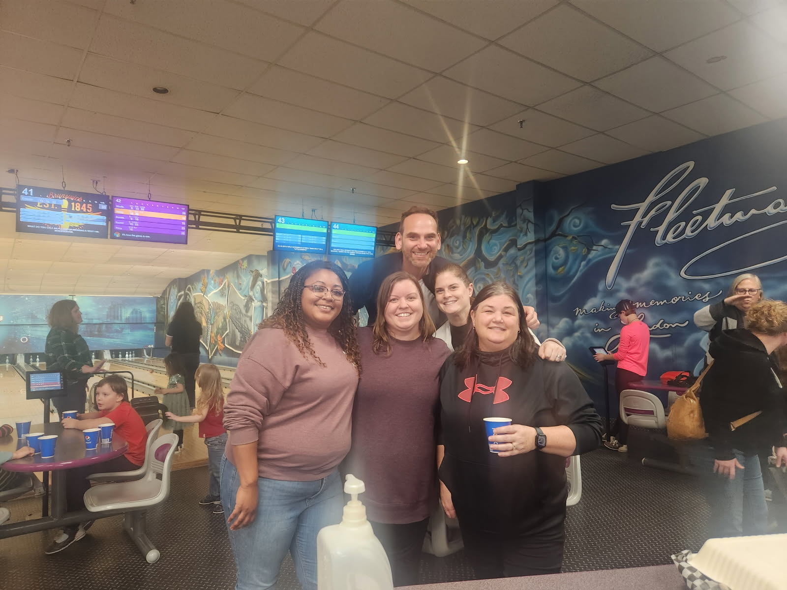 A group picture of Forward House of London at a bowling event.